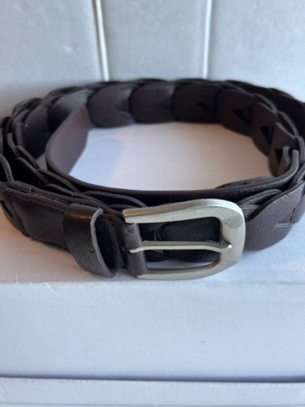 Brown braided leather belt.